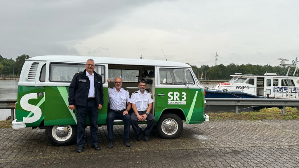 Michael Klein, Arno Schmidt und Detlef Mertes im GuMo Mobil vor der WSP4