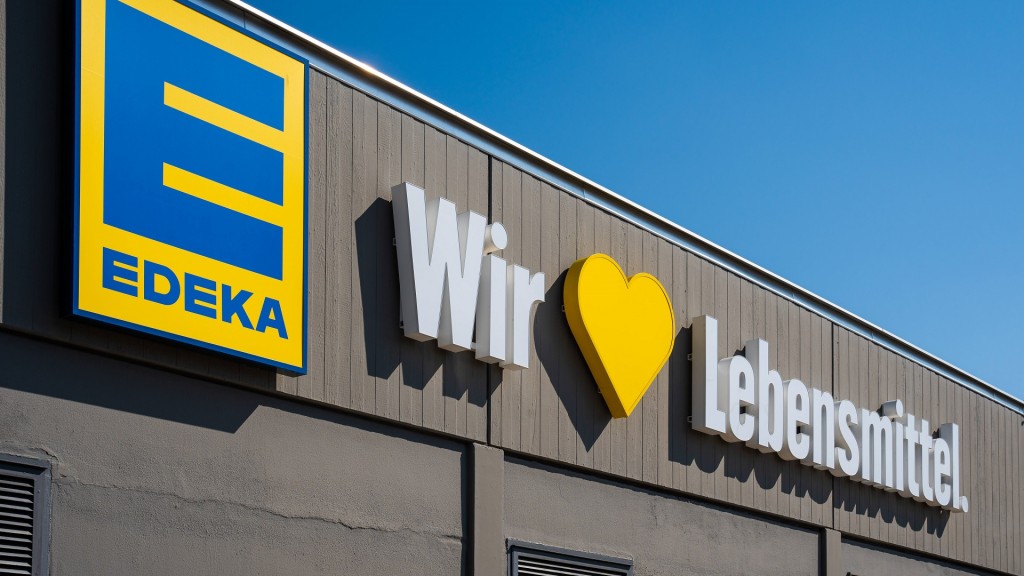 Edeka. Firmenlogo mit Werbespruch 