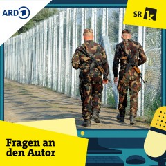 Soldaten an einem Grenzzaun
